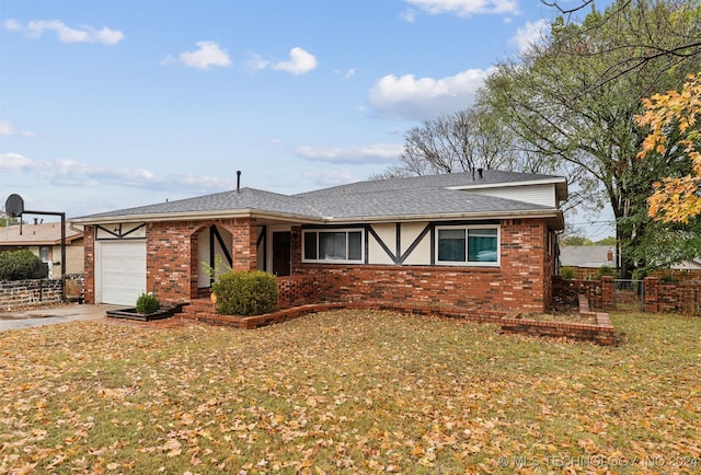 single story home featuring a garage and a front yard