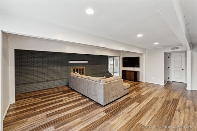 living room featuring a fireplace and hardwood / wood-style flooring