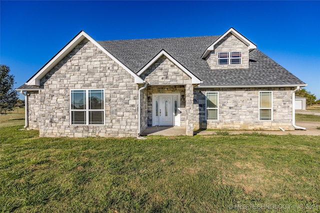 craftsman inspired home with french doors and a front yard