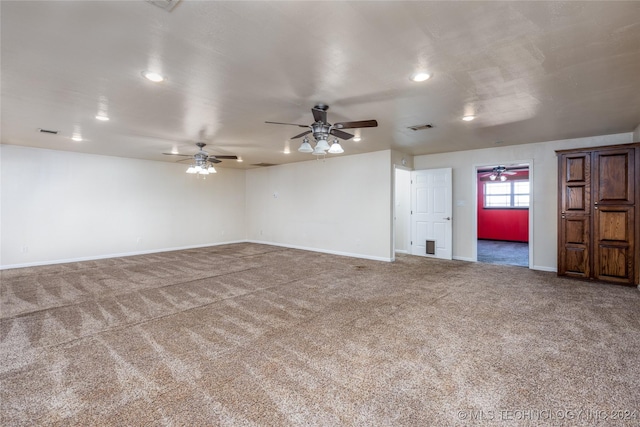 empty room featuring carpet floors, a ceiling fan, baseboards, and recessed lighting