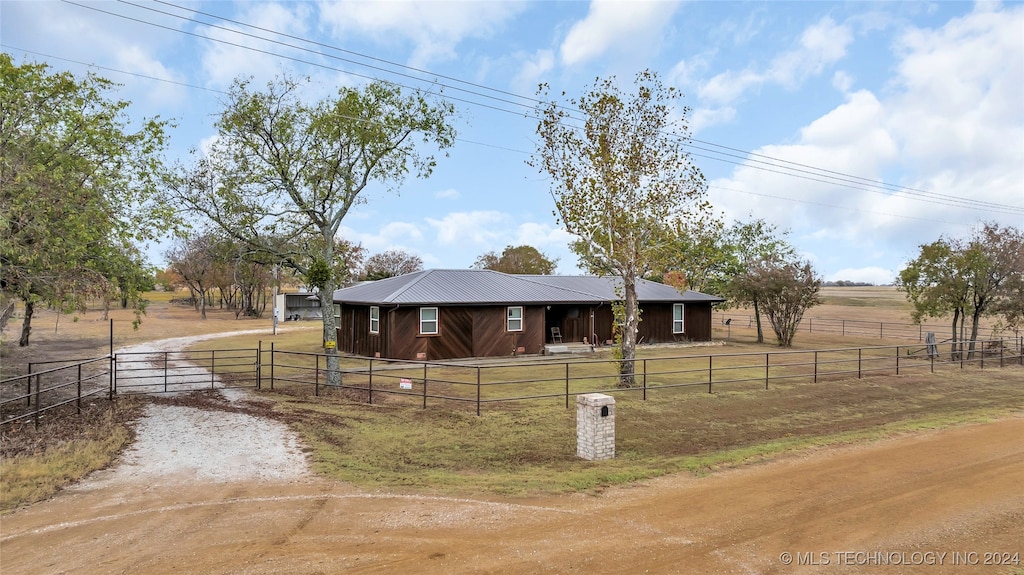 view of horse barn featuring a rural view