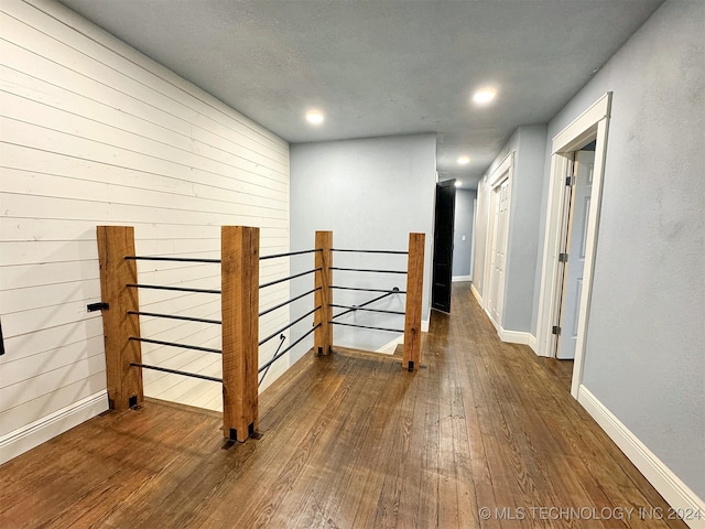 corridor with dark wood-type flooring