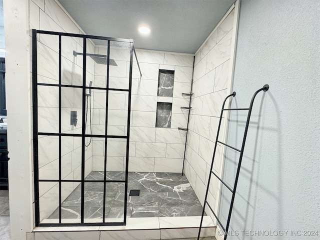 bathroom with tiled shower