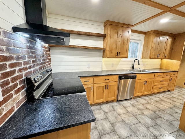 kitchen with extractor fan, appliances with stainless steel finishes, light wood-type flooring, sink, and brick wall