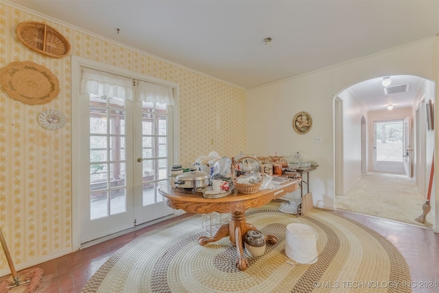 dining room with french doors and crown molding