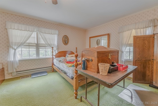 carpeted bedroom featuring baseboard heating, ceiling fan, and crown molding