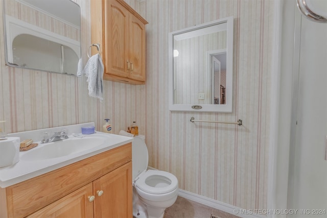 bathroom with vanity and toilet