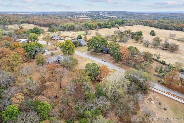 birds eye view of property with a rural view