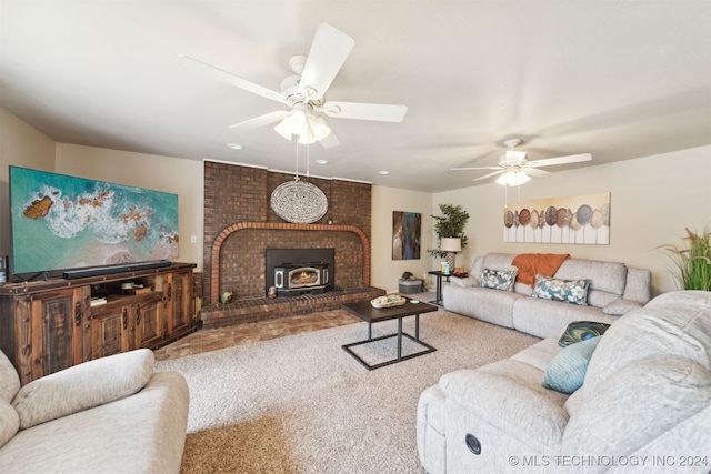 living room with carpet, a wood stove, and ceiling fan