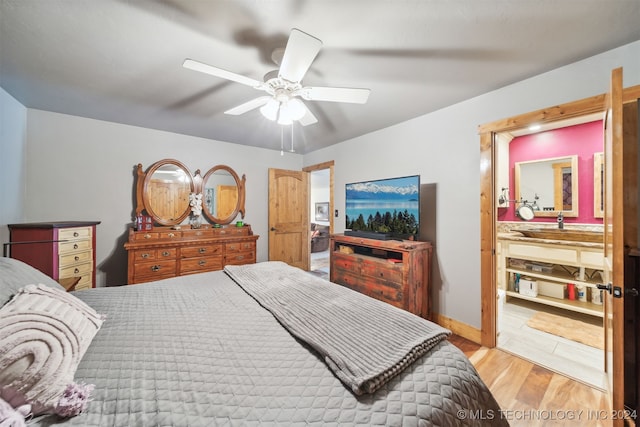 bedroom with light wood-type flooring and ceiling fan