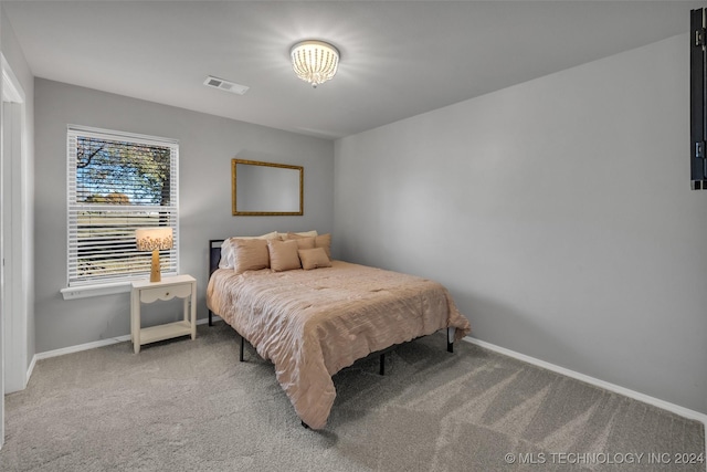 carpeted bedroom with baseboards