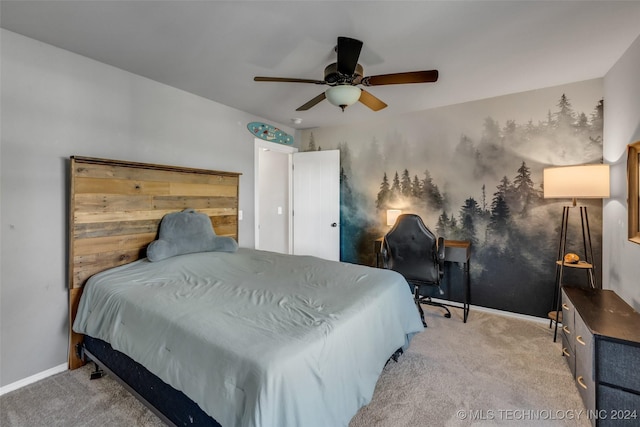 carpeted bedroom with baseboards and ceiling fan