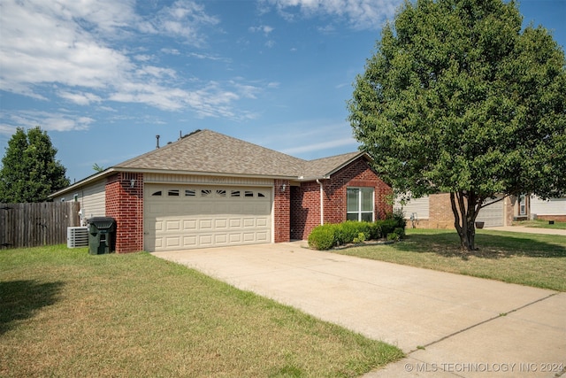 single story home featuring a garage, cooling unit, and a front lawn