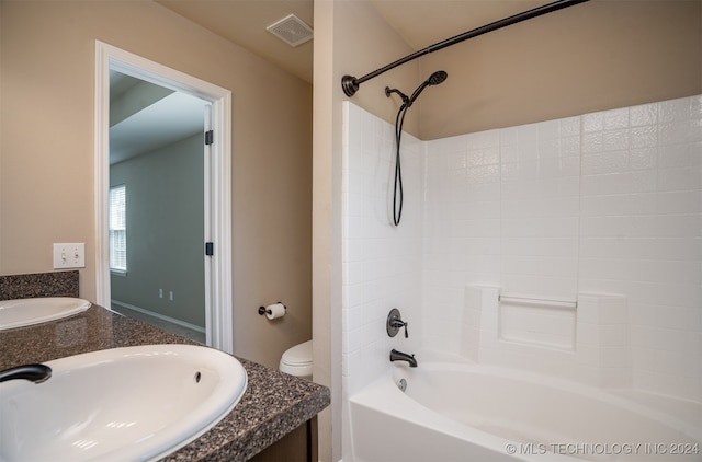 full bathroom with toilet, vanity, and shower / bathtub combination