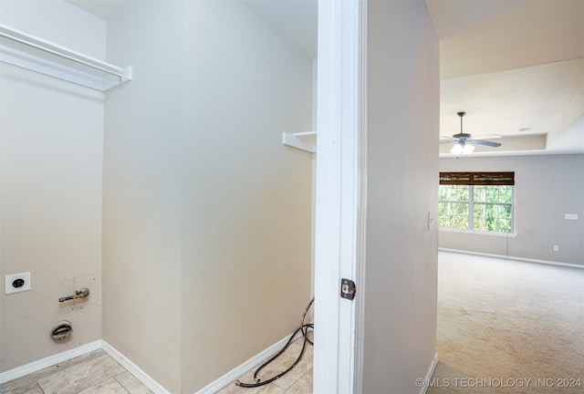 washroom with electric dryer hookup, light carpet, and ceiling fan