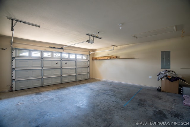 garage featuring electric panel and a garage door opener