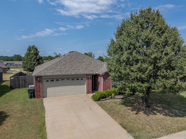 single story home featuring a front yard and a garage