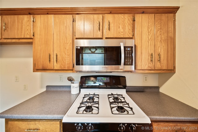 kitchen with white gas range oven