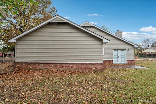 view of property exterior featuring a yard