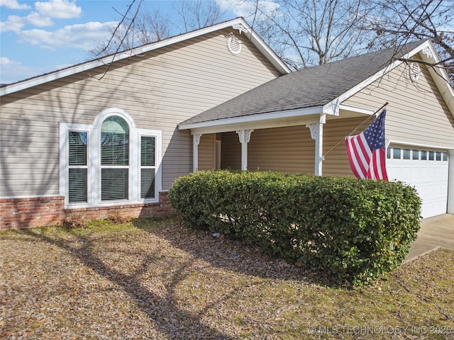 view of side of home with a garage