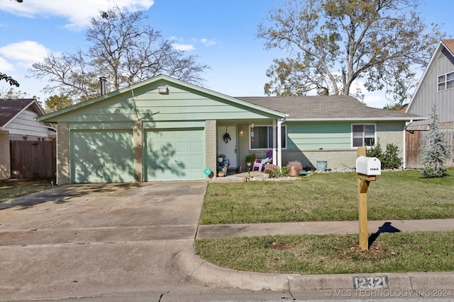 single story home with a front lawn and a garage