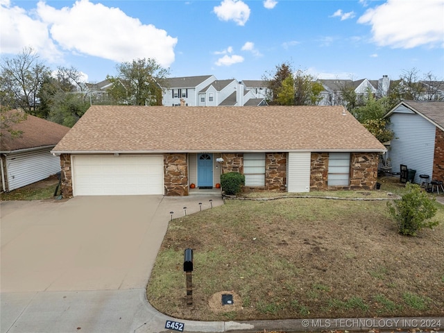 single story home featuring a garage