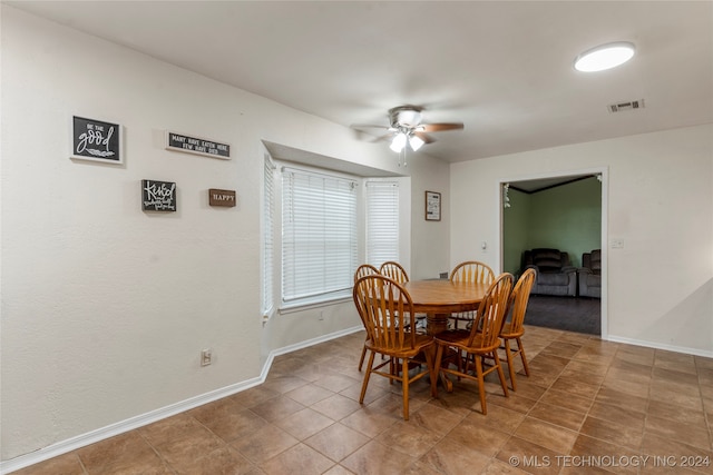 dining area featuring tile patterned floors and ceiling fan