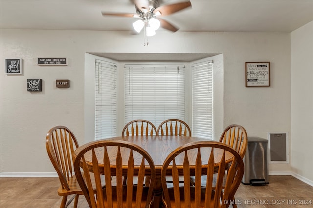 dining room with ceiling fan and light tile patterned flooring