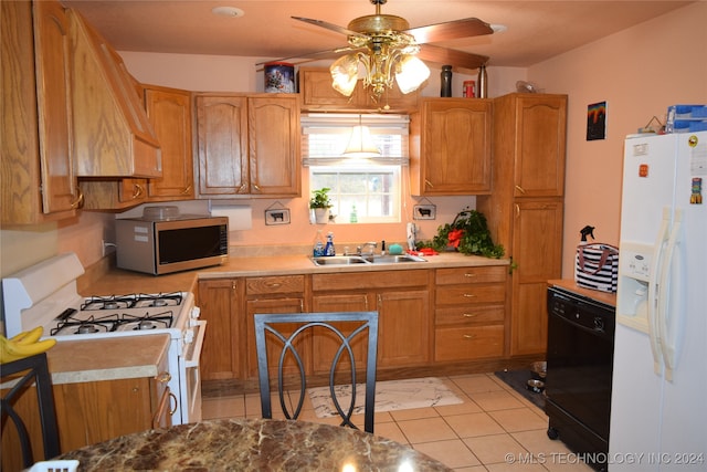 kitchen featuring white appliances, sink, light tile patterned floors, and ceiling fan