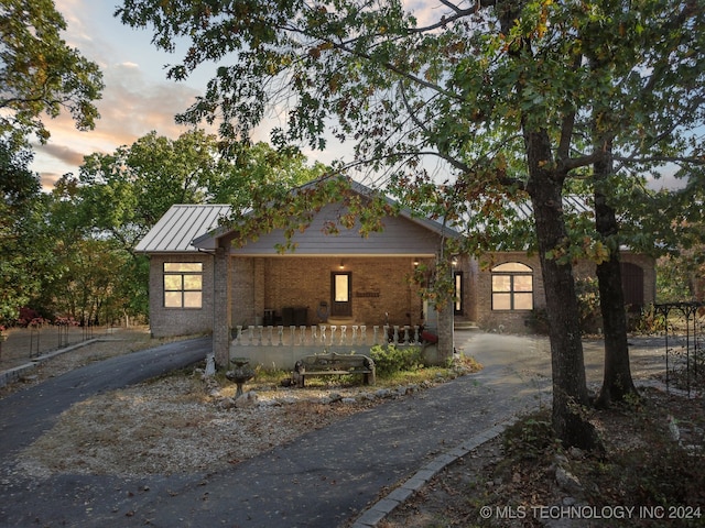 view of front of home featuring covered porch