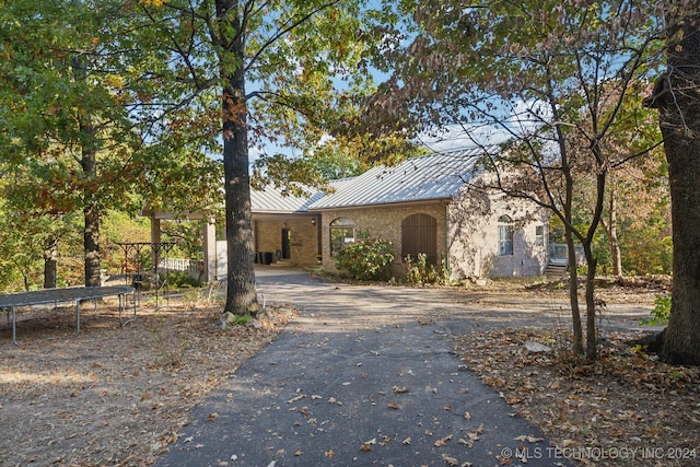 view of front of home with a trampoline