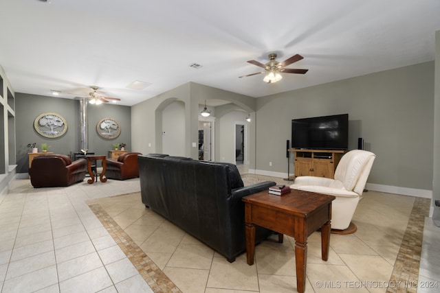 living room with light tile patterned floors and ceiling fan