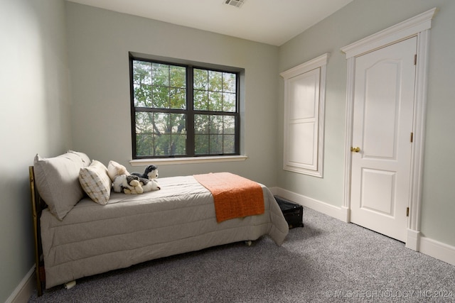 washroom with washing machine and clothes dryer, tile patterned flooring, and cabinets