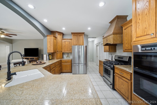 kitchen featuring kitchen peninsula, premium range hood, stainless steel appliances, sink, and light tile patterned flooring