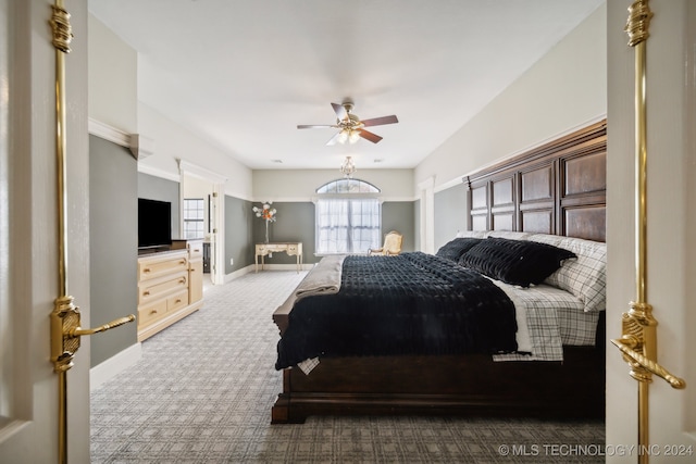 carpeted bedroom featuring ceiling fan