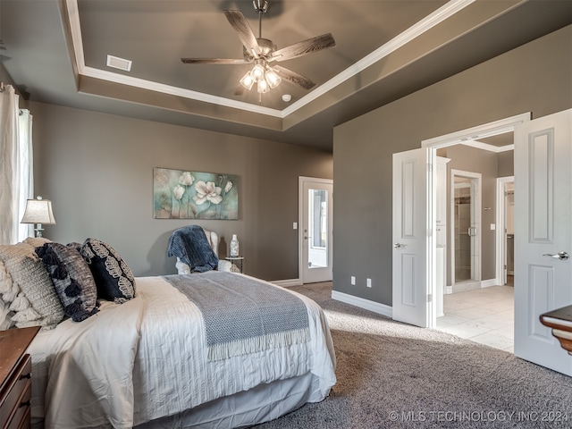 bedroom featuring light colored carpet, ceiling fan, and a raised ceiling