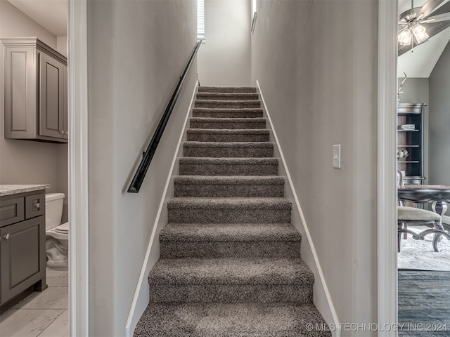 staircase with ceiling fan