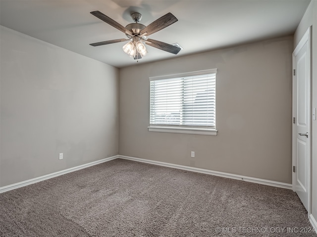 spare room with carpet flooring and ceiling fan