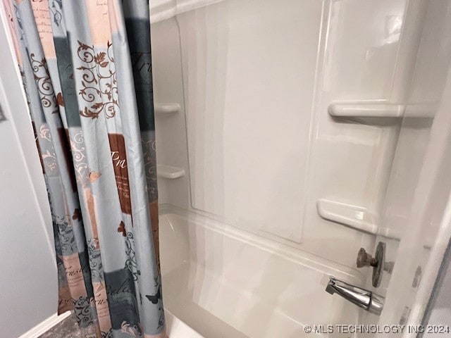 bathroom featuring shower / bathtub combination with curtain