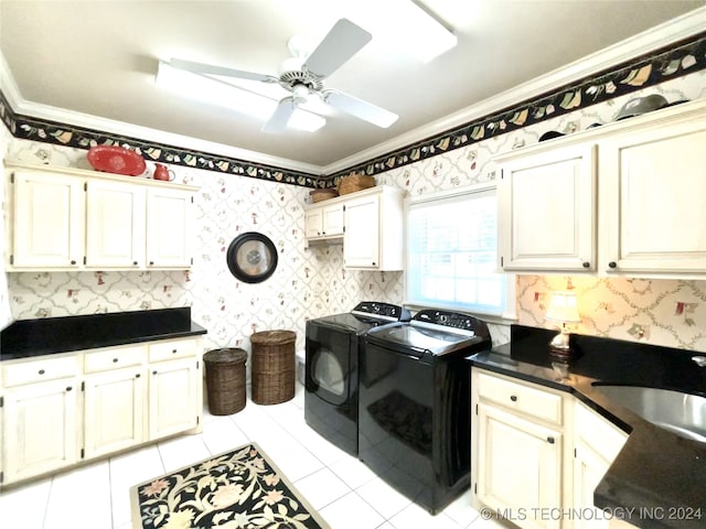 washroom with cabinets, sink, ceiling fan, crown molding, and independent washer and dryer