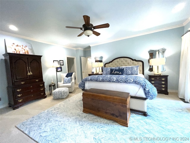 carpeted bedroom featuring ornamental molding and ceiling fan