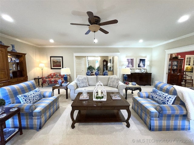 living room with ceiling fan, light carpet, and ornamental molding