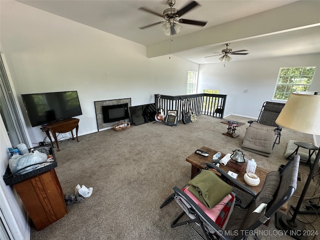 carpeted living room featuring ceiling fan