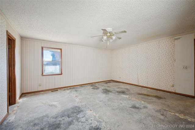 spare room featuring ceiling fan, a textured ceiling, and concrete floors