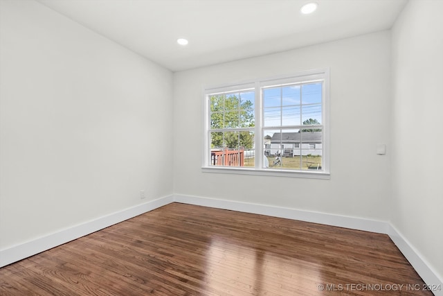 spare room featuring hardwood / wood-style floors