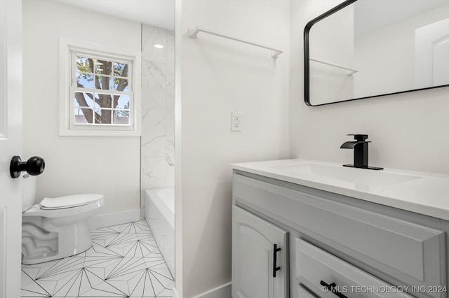 full bathroom with tile patterned flooring, washtub / shower combination, vanity, and toilet