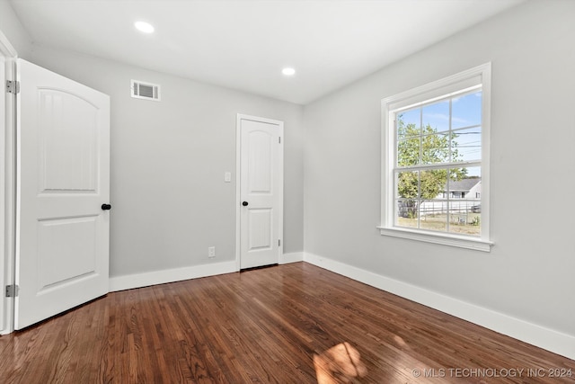 empty room with wood-type flooring