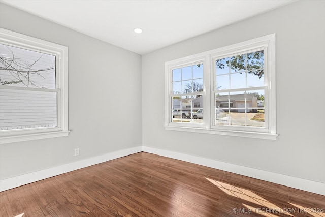 unfurnished room featuring wood-type flooring