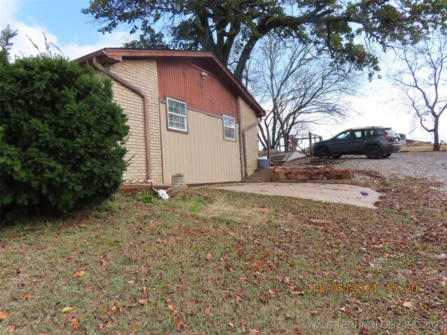 view of home's exterior with a yard