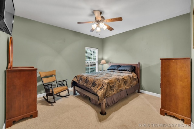 bedroom with carpet flooring, a ceiling fan, and baseboards